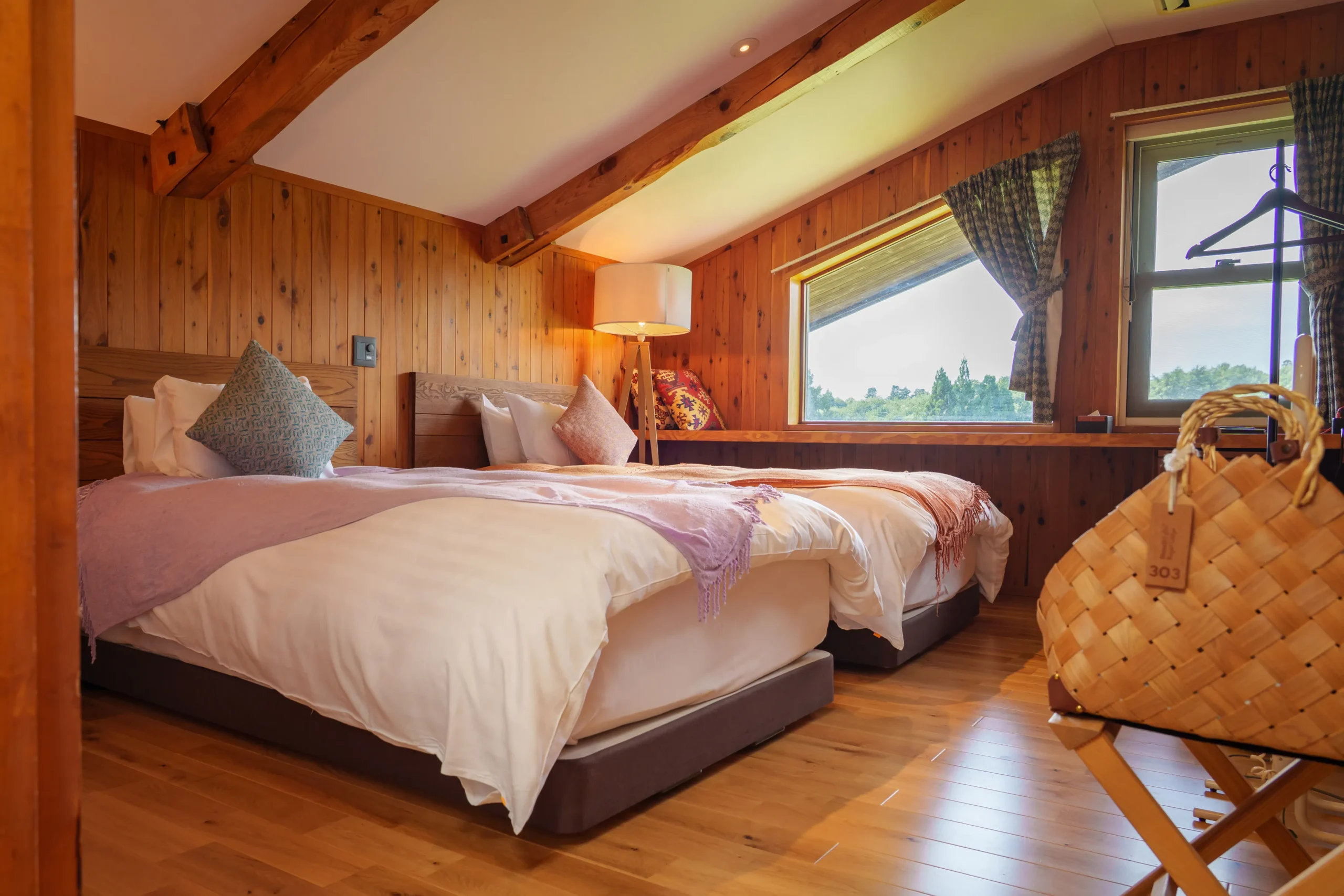 “Sir Hilary’s Room,” a cozy space filled with the warmth of natural wood