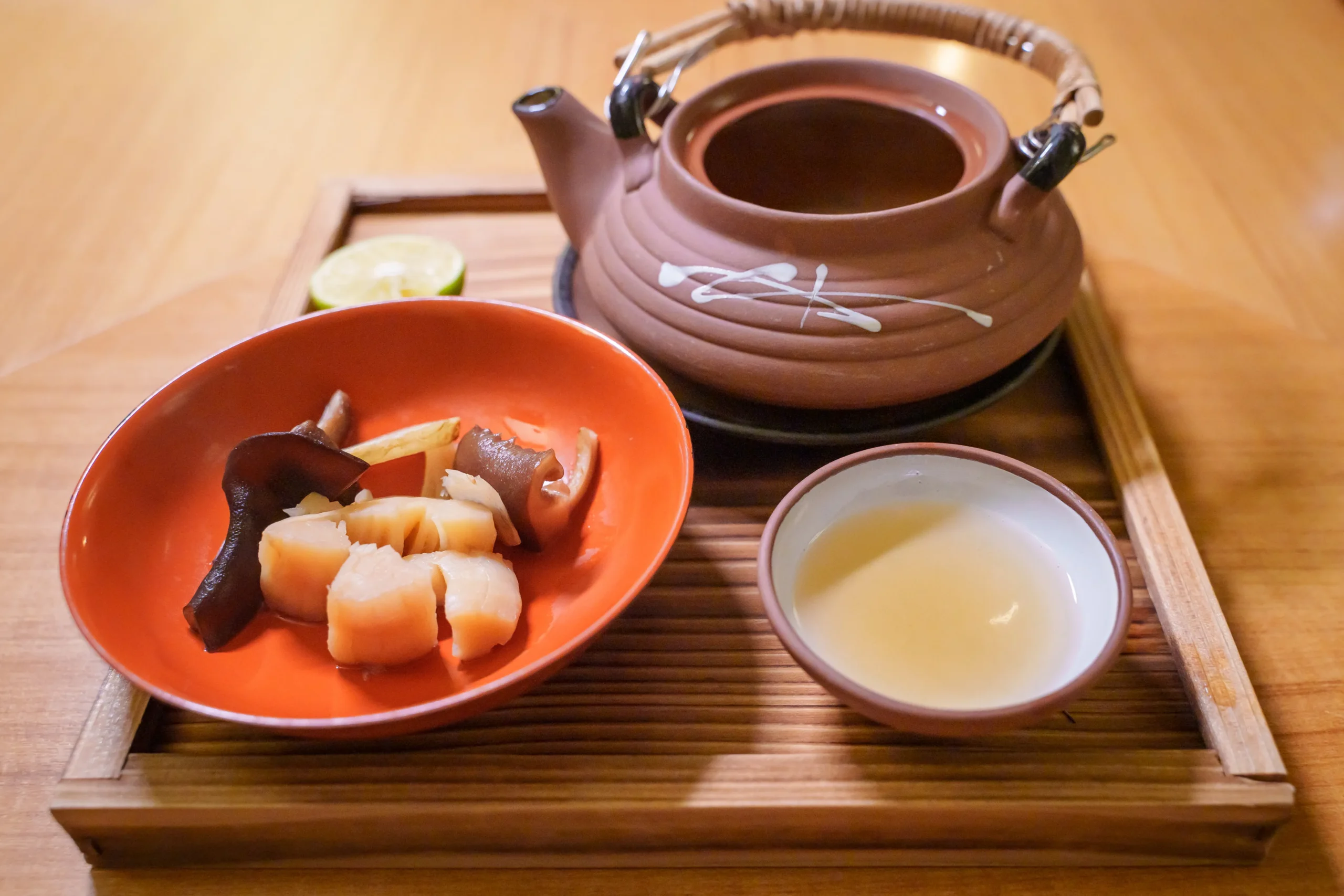 Herbal soup served in a traditional dobin-mushi (teapot-steamed) style
